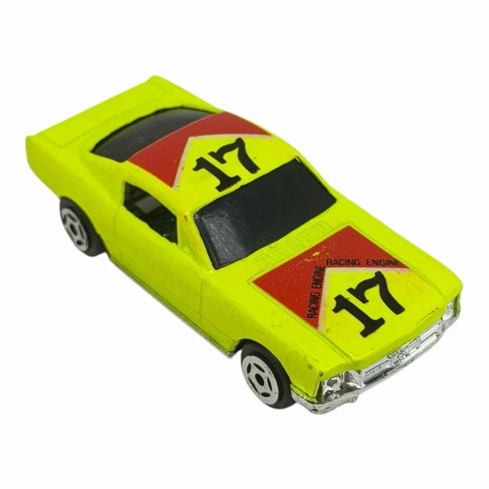 Vintage Yellow Diecast Toy Car with Racing Decals‎